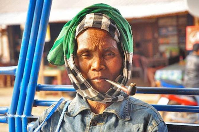 Laos Farming Woman in Laung Prabang in Transport.jpg